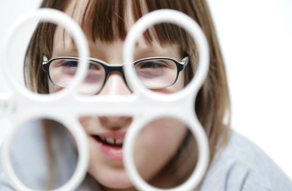 a child uses a prism flipper during vision therapy