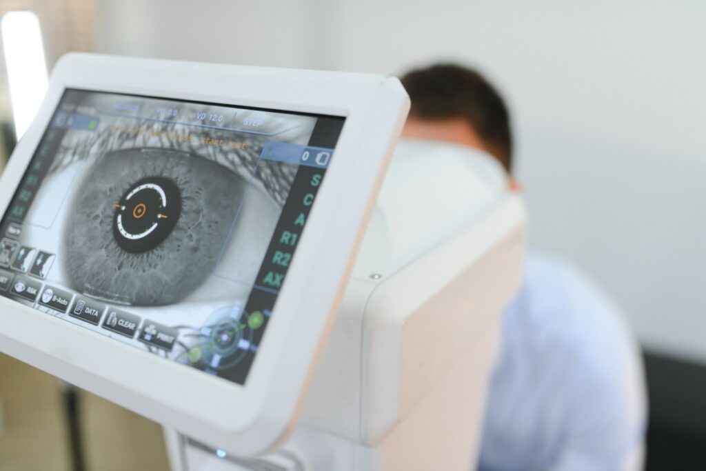 Close-up of a digital retinal imaging device displaying a detailed scan of a patient’s eye during an eye exam.